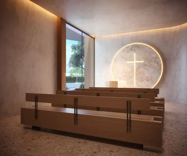 Espaço ecumênico do Elevare, em enquadramento vertical, com banco corrido e luz zenital