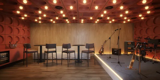 Garage band do Elevare, com instrumentos, tratamento acústico e iluminação dirigida