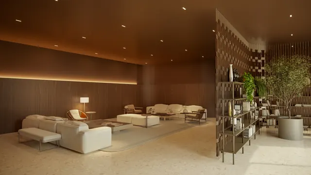 Lobby do Elevare, com pé direito duplo, pedra clara e mobiliário baixo
